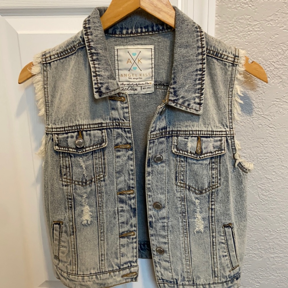 Distressed denim vest